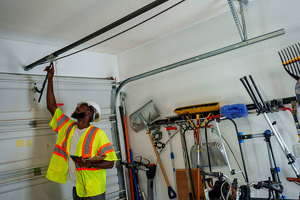 Professional Garage Door Panel Replacement technician working in South Barre, VT
